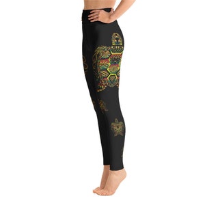May include: Black yoga leggings featuring a colourful patterned sea turtle design. The leggings have a high waist and are made from a stretchy, comfortable fabric.