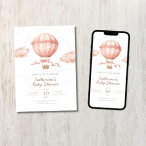 May include: A baby shower invitation featuring a watercolor hot air balloon in shades of pink and peach. The invitation includes the text "Join us to celebrate Catherine's Baby Shower" with the date and time. The design is also displayed on a smartphone.