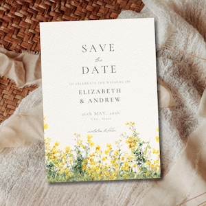 May include: A cream-colored wedding invitation with the text "SAVE the DATE" at the top. The invitation includes the names Elizabeth & Andrew, and the date May 26th, 2026. Yellow floral watercolor art decorates the bottom.