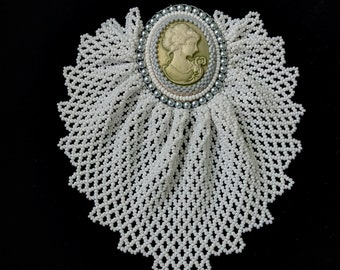 Beaded jabot brooch with cameo.