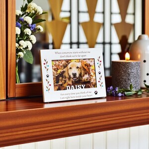 May include: White photo frame with a picture of a golden retriever named Daisy. The frame has decorative paw prints and hearts, with the text "When tomorrow starts without me don't think we're far apart" and "For every time you think of me I am right here inside your heart."