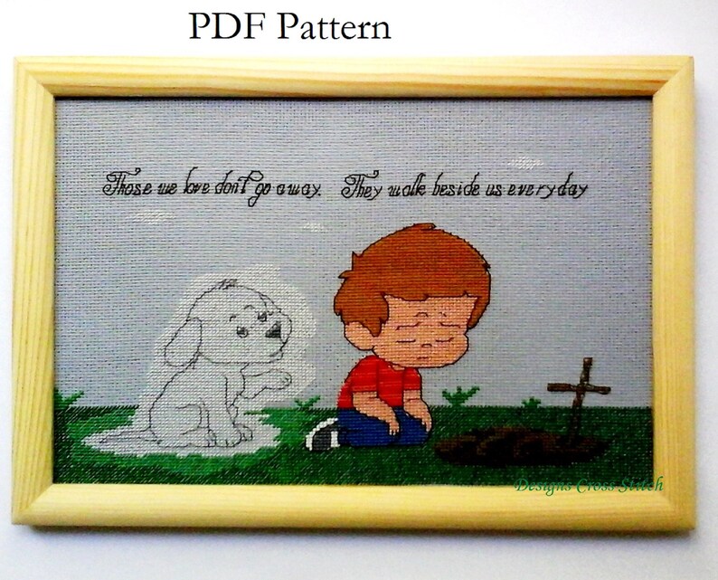 K&ouml;nnte beinhalten: Kreuzstichmuster mit einem Jungen, der neben einem Grab mit einem Kreuz kniet. Ein wei&szlig;er Hund erscheint als Geist neben ihm. Der Text lautet "Those we love don't go away. They walk beside us everyday."