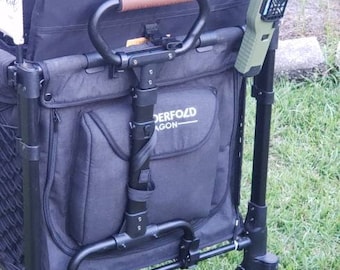 May include: A black and gray wagon with a brown handle and a green fan attached to the side. The wagon has a black fabric bag with the words "Underford Wagon" printed on it.