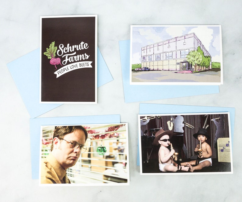 May include: Four different cards featuring images related to the TV show "The Office". The first card has a brown background with white text that reads "Schrute Farms People Love Beets". The second card has a watercolour illustration of the office building. The third card shows a photo of a man with brown hair and glasses looking out of a window. The fourth card shows a photo of two babies dressed in black hats and sunglasses playing musical instruments.