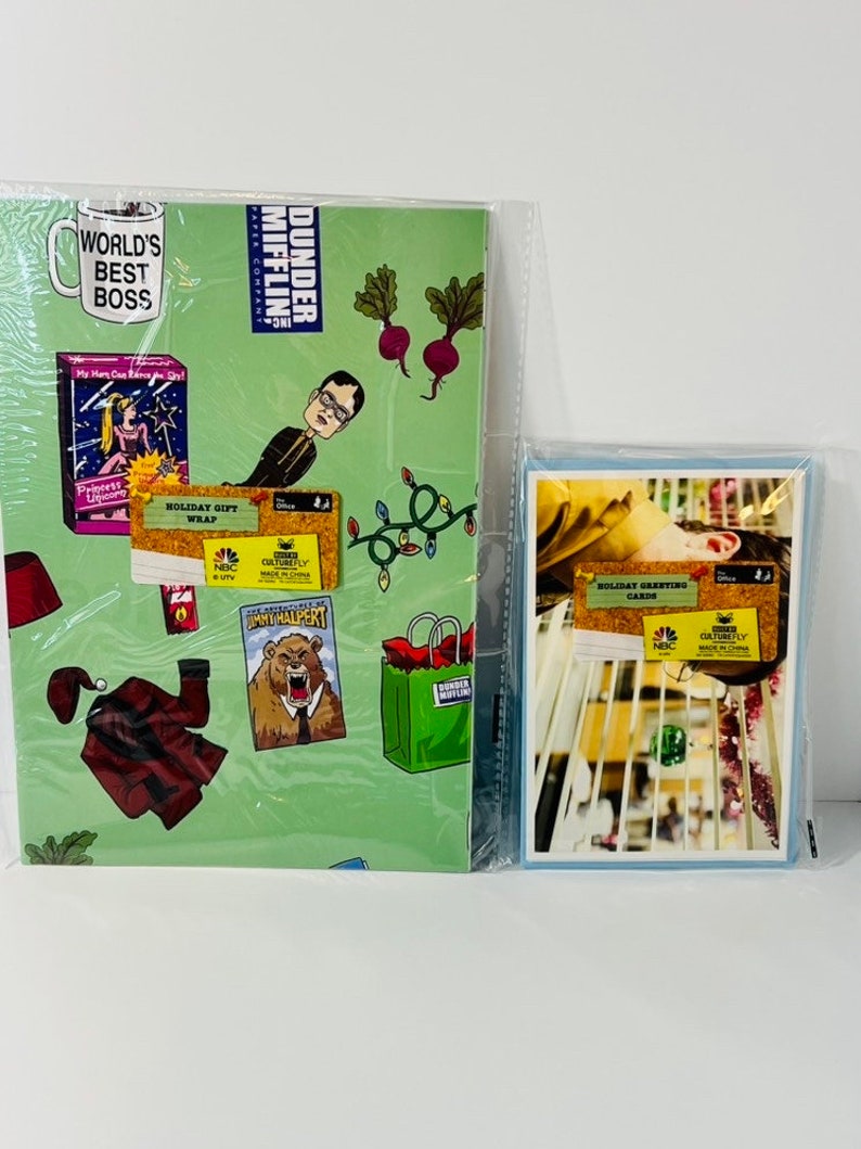 May include: Green and white wrapping paper featuring characters and scenes from the TV show "The Office". The paper includes the text "Dunder Mifflin" and "World's Best Boss".