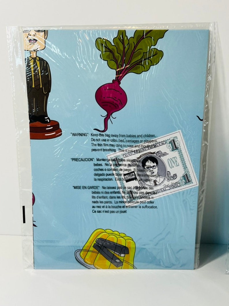 May include: A blue and white card with a cartoon image of a beet and a man with glasses. The card has a warning about keeping the bag away from babies and children. The text on the card is in English, Spanish, and French.