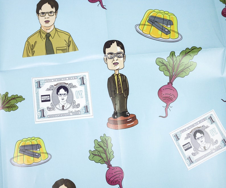 May include: A blue background with various stickers featuring a character from the TV show "The Office". The stickers include a cartoon of the character, a dollar bill with the character's face on it, a beetroot, and a bowl of yellow jelly with a stapler inside.