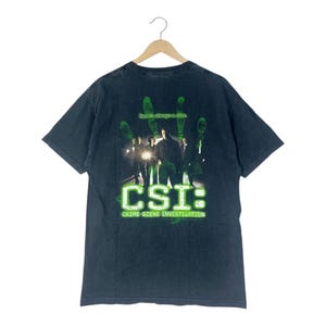 Maglietta vintage Y2K Crime Scene Investigation (CSI) – “C'è sempre un indizio” – Serie drammatica misteriosa della CBS/ Taglia L