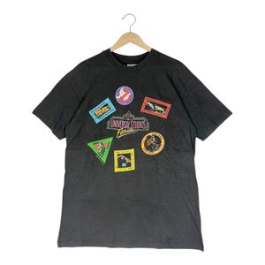 Maglietta vintage anni '80 Universal Studios Hollywood Box Office Movies / Ritorno al futuro Lo squalo, Ghostbuster / Maglietta nera / Taglia XL / Prodotta negli Stati Uniti