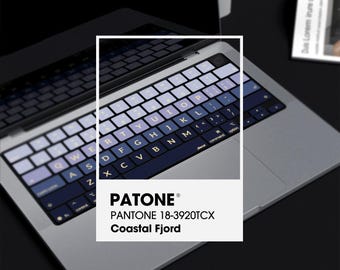 May include: A blue and gray keyboard sticker set for a Macbook laptop. The sticker set features a gradient color scheme with a dark blue base and a light gray top. The sticker set is labeled "PATONE® PANTONE 18-3920TCX Coastal Fjord".