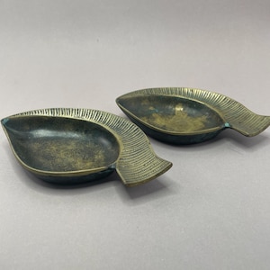 Two vintage brass ashtrays