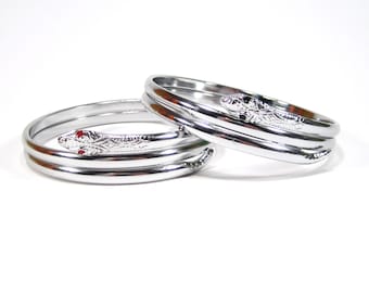 Silver snakes bangle approx. 4 cm in size adjustable