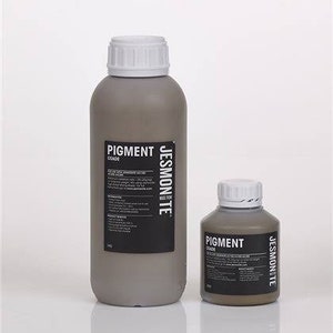 K&ouml;nnte beinhalten: Zwei Pigmentflaschen, eine gro&szlig;e und eine kleine, beide in grauer Farbe mit einem schwarzen Etikett, auf dem "Pigment Jessmonte" steht.