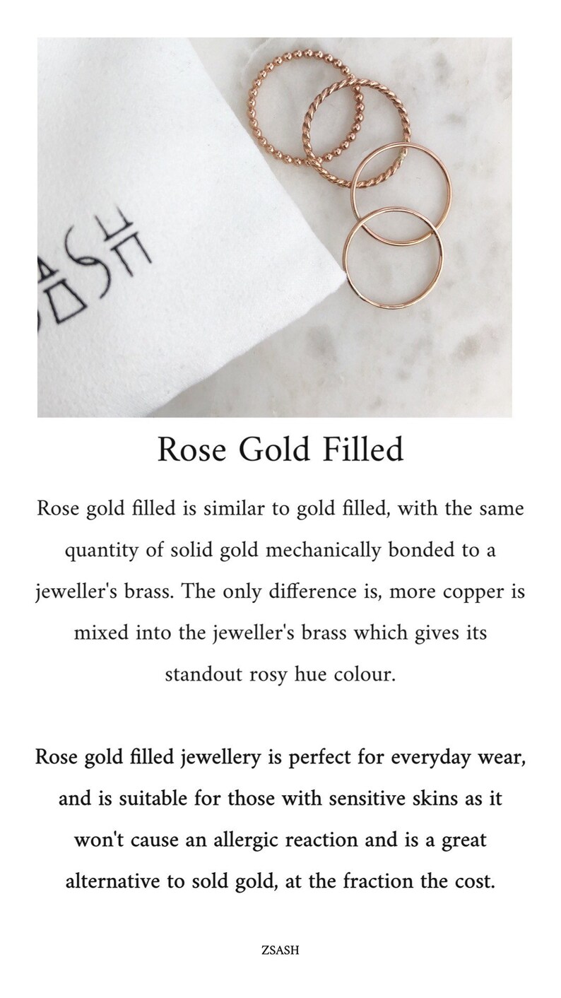 May include: Three rose gold filled rings on a white surface. The rings are different styles, including a beaded ring, a twisted ring, and a plain band. The text "Rose Gold Filled" is written below the rings.