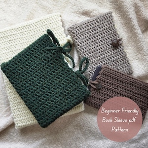May include: Four handmade crochet book sleeves in various colors: cream, forest green, gray, and brown. The green sleeve has a tie closure. The gray and brown sleeves have a button closure. The image includes the text "Beginner Friendly Book Sleeve pdf Pattern".
