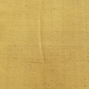 May include: A close-up of a woven fabric with a natural, light brown colour. The fabric has a rough texture and a slightly uneven weave.