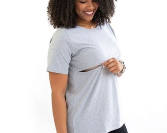 May include: A gray short-sleeved t-shirt with a hidden nursing panel. The shirt is made of a soft, comfortable fabric and has a relaxed fit.