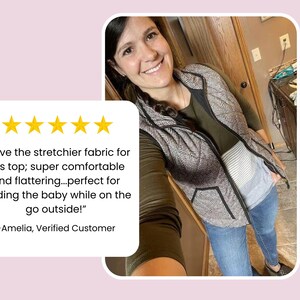 Mom wearing an olive long sleeve nursing shirt with a hidden zipper for breastfeeding access on the go.