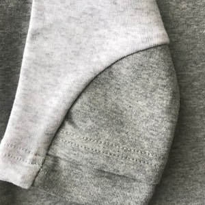 Light gray nursing sweatshirt with zipper access for breastfeeding