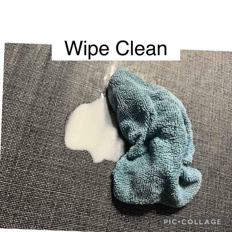 May include: A blue microfiber cleaning cloth on a gray textured surface with a white stain. The text "Wipe Clean" is above the cloth.