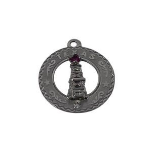 May include: A dark gray pendant featuring a detailed depiction of a lighthouse, with a small red gem at the top. The pendant is circular, with the word "TEXAS" inscribed around the edge.