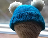 Hand knit child winter hat with double pom pom