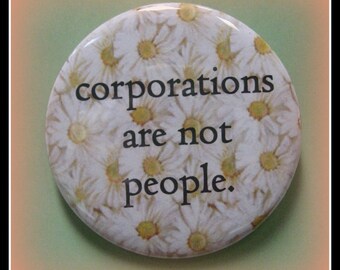 2 1/4" pinback button. Sorry but they are not.