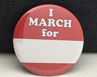 2 1/4" pinback button. You can create a custom message on this I MARCH FOR button.