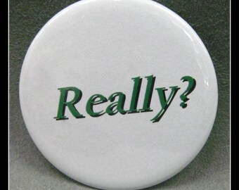 2 1/4" pinback button. Every day it gets more unbelievable.