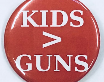 2 1/4" pinback button. Kids > Guns