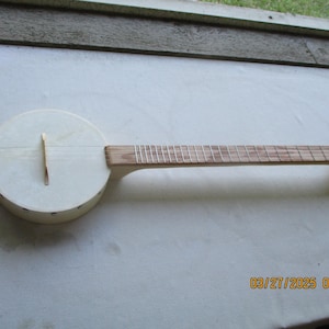 4-strängad banjo-pinne