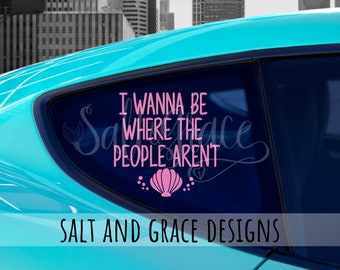 May include: A pink vinyl decal with the text "I wanna be where the people aren't" and a pink seashell graphic. The decal is on the back window of a turquoise car. The text "Salt and Grace Designs" is below the decal.