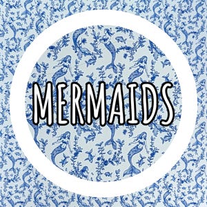 May include: A white circular design with the word "MERMAIDS" in black letters with a white outline, set against a blue and white mermaid pattern. The pattern features mermaids, fish, and aquatic plants.