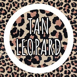 May include: A tan leopard print pattern with black and brown spots. The words "TAN LEOPARD" are in a white circle in the center of the image. The background is a repeating leopard print.