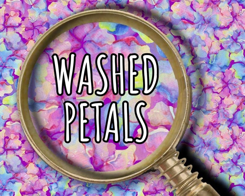 May include: A magnifying glass with a gold-colored frame is centered over a floral pattern. The text "WASHED PETALS" is in white, outlined in black. The background features a watercolor-style design in shades of purple, blue, and pink.