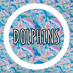 May include: A colorful pattern featuring dolphins in shades of blue and pink, with coral and aquatic plants. The word "DOLPHINS" is displayed in a white circle. The design is vibrant and suitable for various applications.