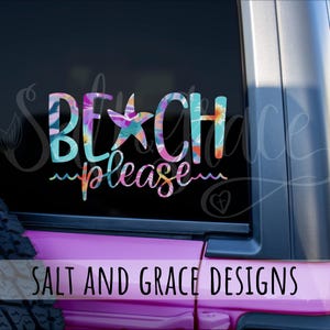 May include: A colorful decal with the words "BEACH please" in a whimsical font. The letters are filled with a floral pattern in shades of blue, purple, and orange. A starfish replaces the "A" in BEACH. The decal is on a vehicle window.