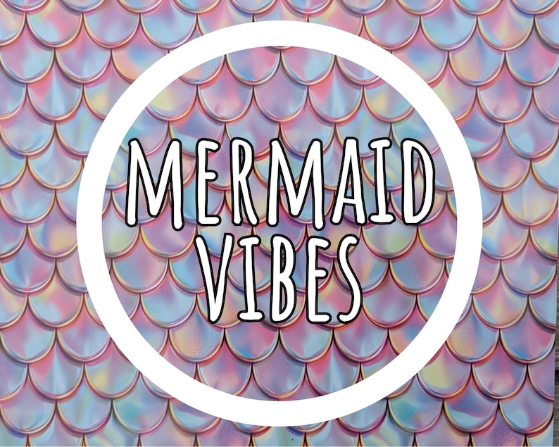 May include: A background with a mermaid scale pattern in shades of pink, blue, and purple. A white circle in the center contains the words "MERMAID VIBES" in a bold, black font. The overall theme is aquatic and fantasy.