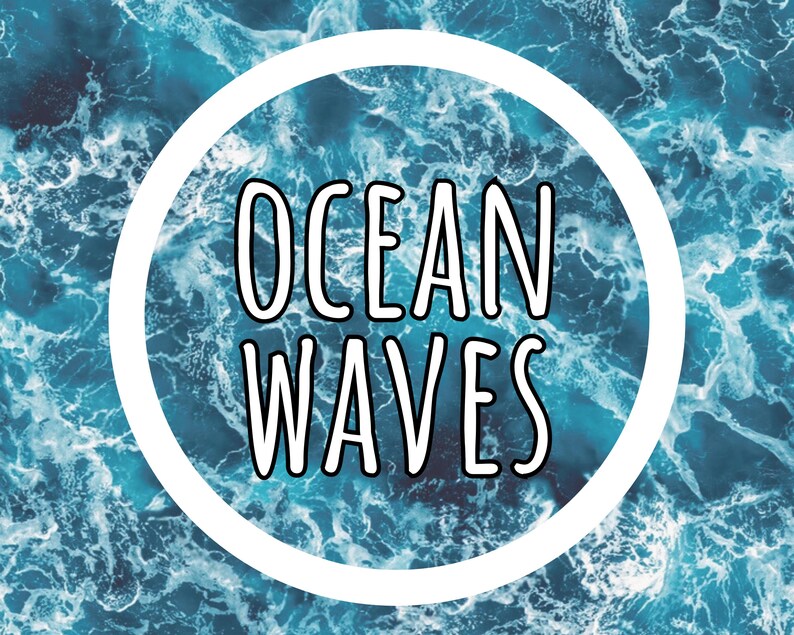 May include: A circular graphic design featuring a high-resolution photograph of churning blue and white ocean waves. Centered within the white circular border is the text "OCEAN WAVES" written in a bold, black, sans-serif, hand-drawn style font.