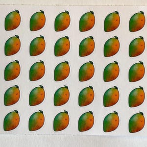 May include: A sheet of stickers featuring a repeating pattern of cartoon mangoes. Each mango is green and orange with a small black stem and a smiling face. The stickers are on a white background.