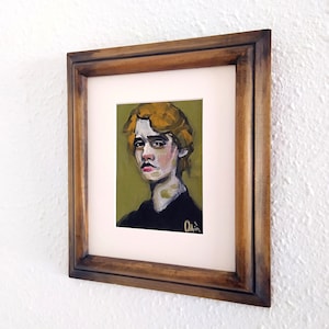 Oil portrait painting of a blond, fair-skinned boy. Framed in a wooden frame. Original and unique.