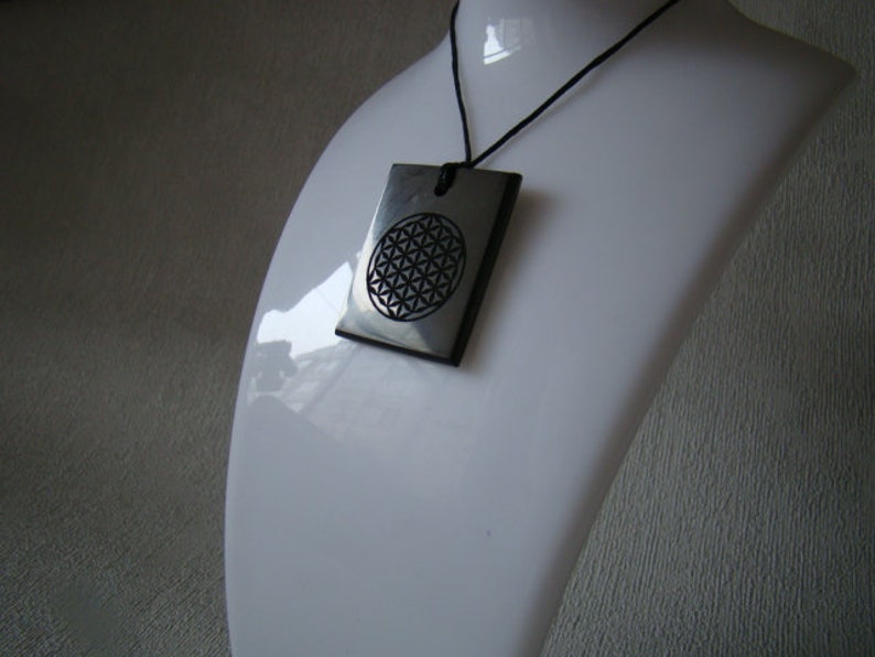 Pendant shungit rectangle laser engraving Flower of Life.