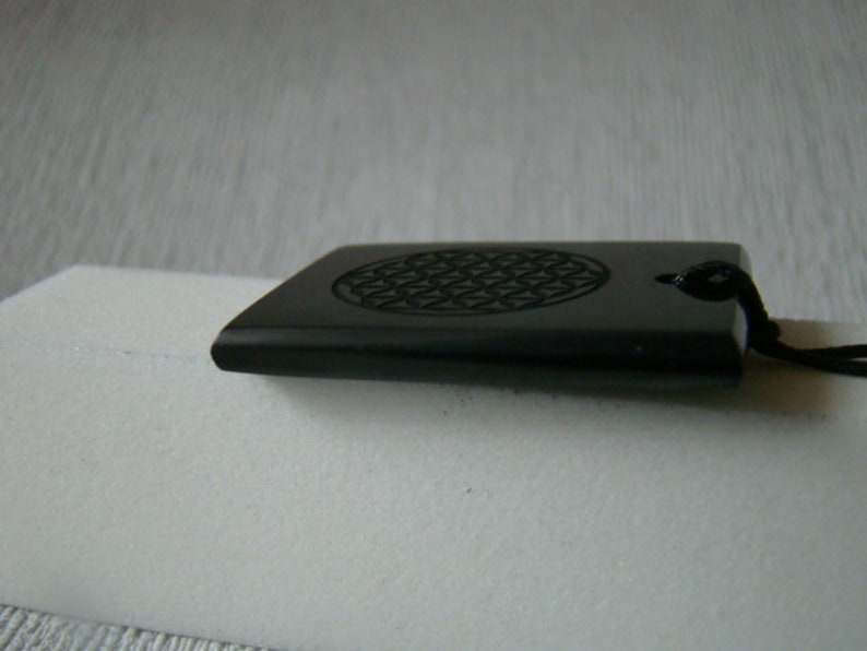 Pendant shungit rectangle laser engraving Flower of Life.