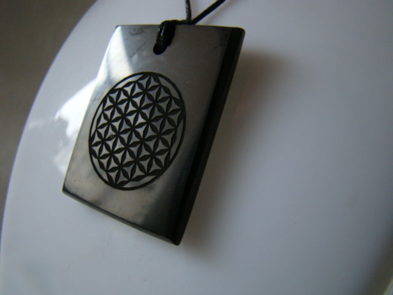 Pendant shungit rectangle laser engraving Flower of Life.