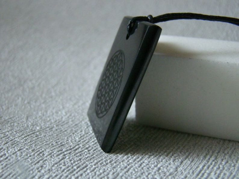 Pendant shungit rectangle laser engraving Flower of Life.