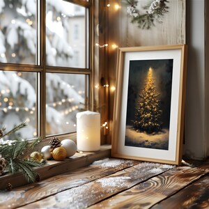 May include: A framed print of a golden Christmas tree on a snowy windowsill. The scene includes a lit candle, ornaments, and a view of a snowy landscape through the window. The wooden frame and window frame add a rustic touch.