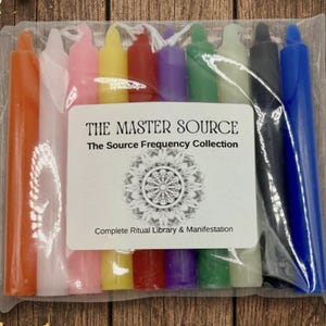 May include: A set of ten multi-colored taper candles packaged in a clear plastic bag. The label reads THE MASTER SOURCE, The Source Frequency Collection, and Complete Ritual Library & Manifestation, featuring a circular mandala-style graphic.