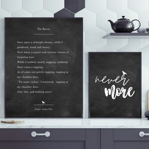May include: Two black framed prints with white text on a black background. The left print features the poem "The Raven" by Edgar Allan Poe. The right print features the text "never more".