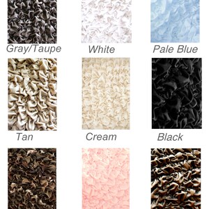 May include: Nine fabric swatches in different colors and patterns. The swatches are arranged in a 3x3 grid. The colors are gray/taupe, white, pale blue, tan, cream, black, camouflage, pale pink, and brown.
