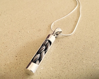 Sterling silver tube pendant with horse hair braid